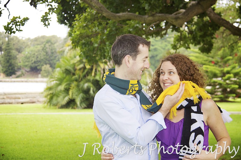Aussie and Kiwi couple battle it out with rugby scarves - engagement photography sydney